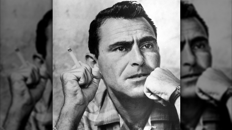 Rod Serling looking away with cigarette in hand