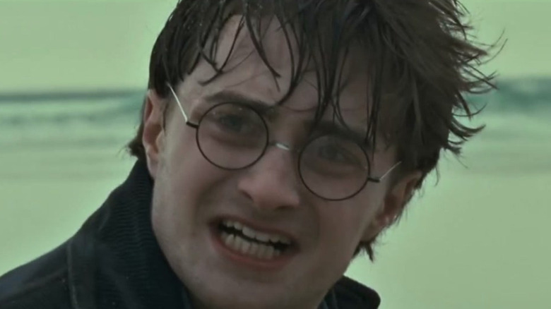 Daniel Radcliffe as Harry Potter looking upset