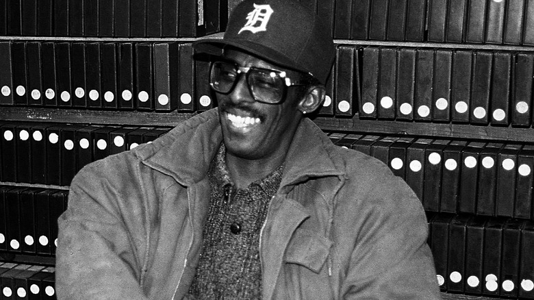 David Ruffin baseball cap glasses smiling in studio