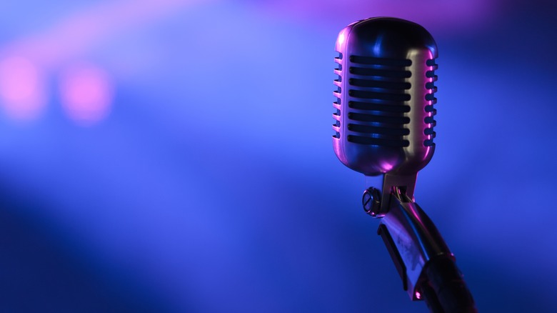 Silver microphone blue background