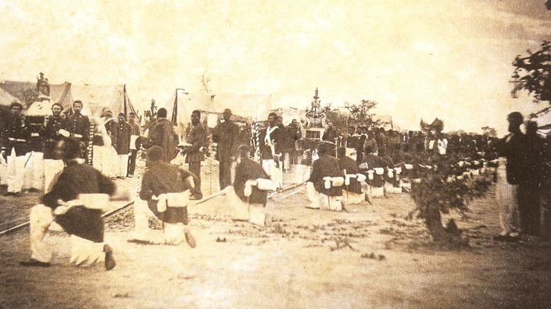 Kneeling Brazilian soldiers encampment Paraguayan war