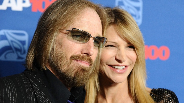 Tom Petty sunglasses and his wife Dana smiling