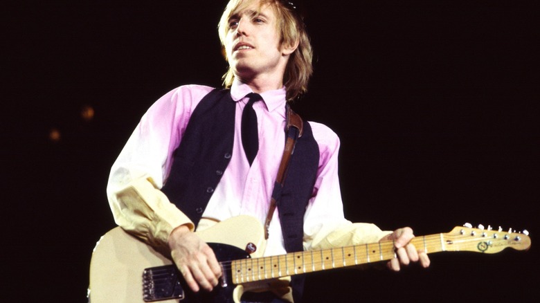 Tom Petty white shirt playing guitar