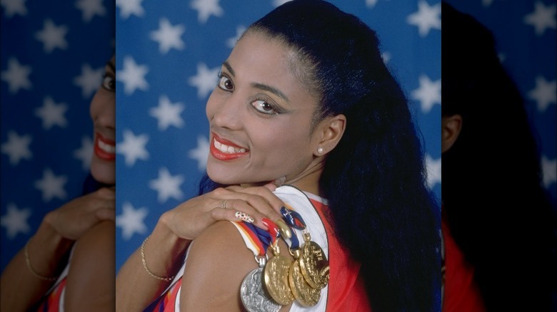 Florence Griffith Joyner, smiling with medals