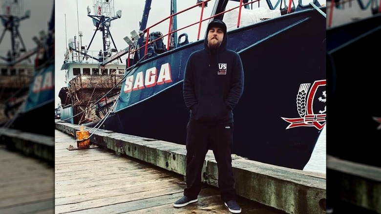 Ross Jones hoodie beard stood by Saga fishing boat