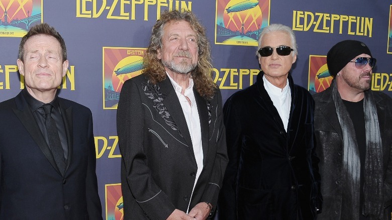 John Paul Jones, Robert Plant, Jimmy Page, and Jason Bonham pose at a premiere