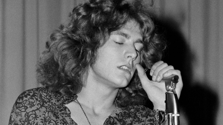 Robert Plant microphone singing long hair