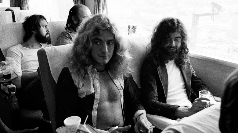 Robert Plant and Jimmy Page sat travelling on a train