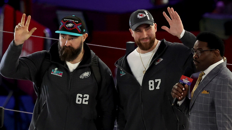 The Kelce brothers waving during an interview