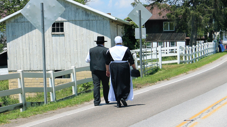 amish couple walking home from church