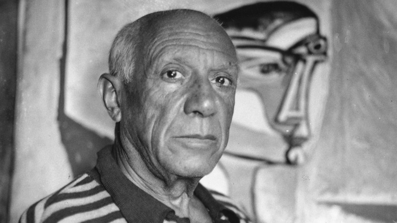Picasso in front of painting