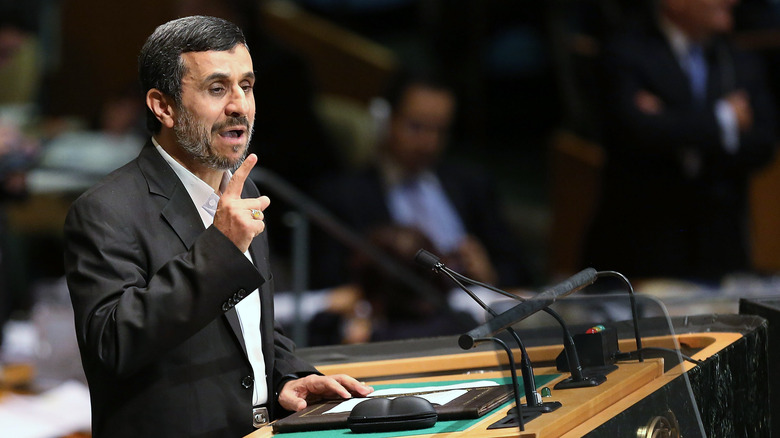 Mahmoud Ahmadinejad speaking at podium
