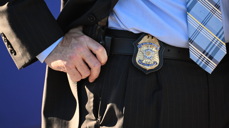 Secret service agent with badge on belt