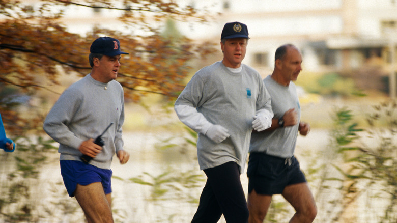 Secret Service agents jogging with Bill Clinton