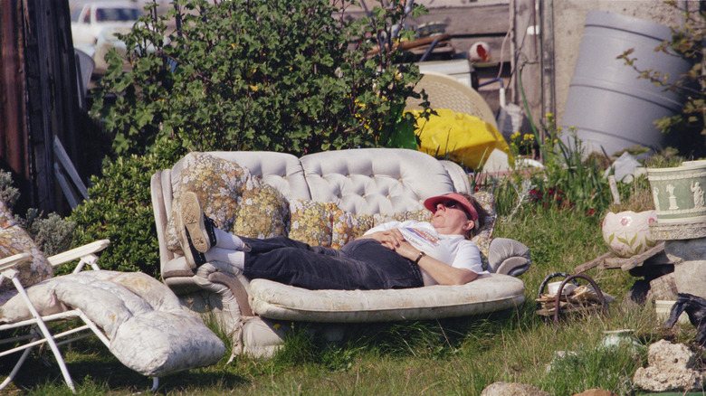 sleeping on an outdoor sofa