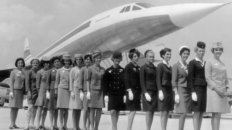 Hostesses stand in front of Concorde