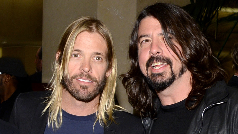 Taylor Hawkins and Dave Grohl smiling 