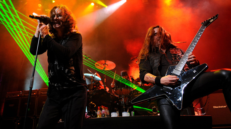 Gus G playing guitar with Ozzy Osbourne