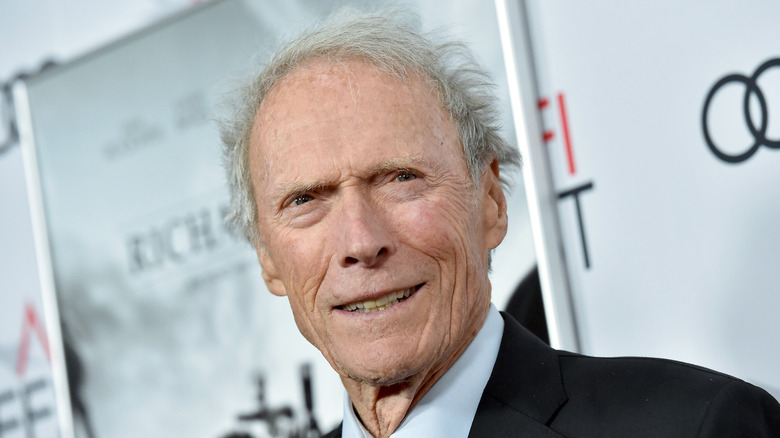 Clint Eastwood smiling wearing suit