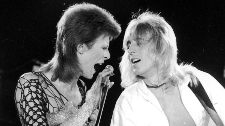 David Bowie and Mick Ronson performing