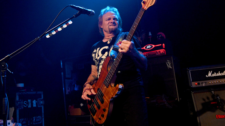 Michael Anthony playing bass on stage