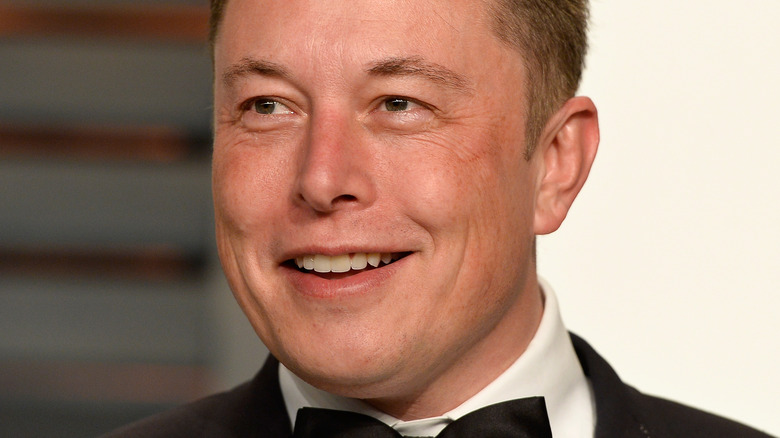 Elon Musk smiling wide