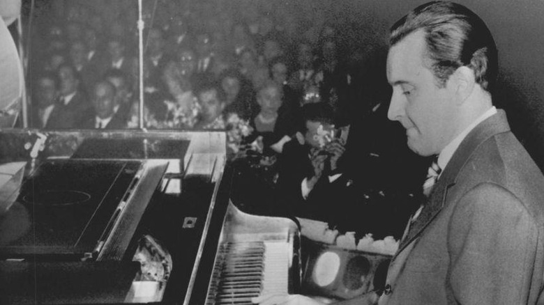 Romano Mussolini playing piano