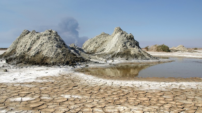 mounds of dirt in dry, cracked lakebed