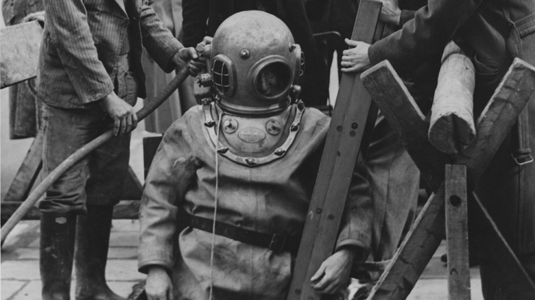 Deepsea diver hooked up to hose