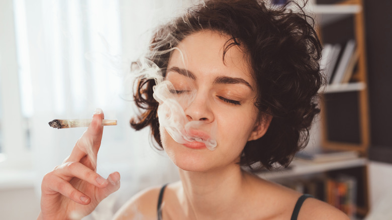 Woman smoking marijuana joint