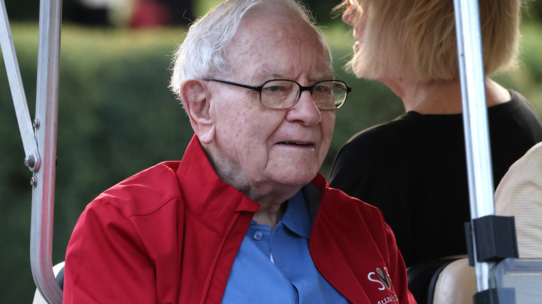 Warren Buffet in a golf cart