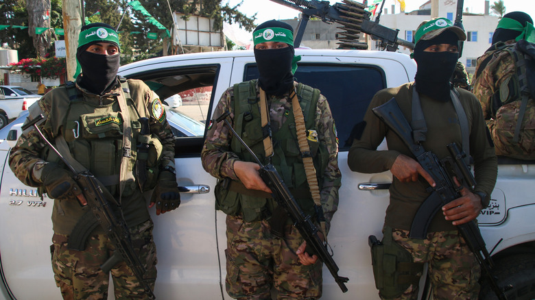 Hamas soldiers standing by truck