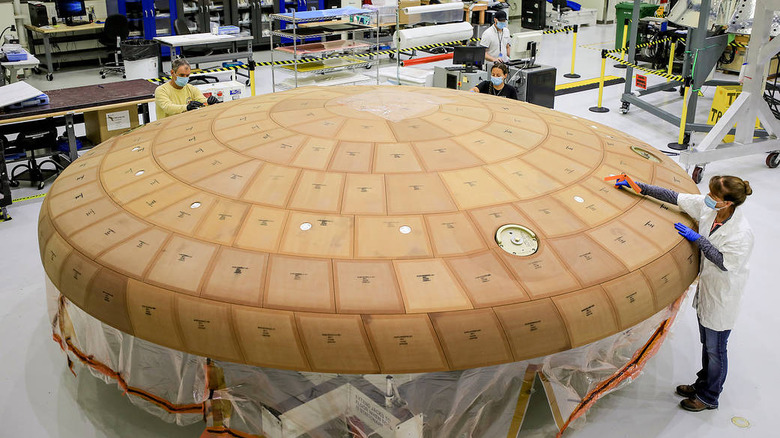 crew working on the orion heat shield