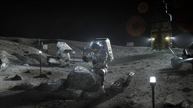 astronauts working on the moon