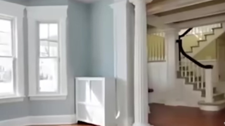 staircase bay window blue wall inside house
