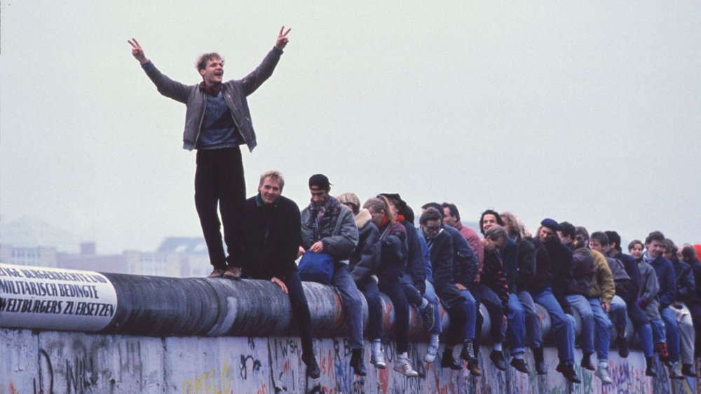 German citizens celebrate on the Berlin Wall