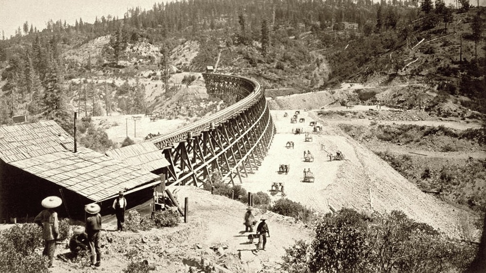 Chinese laborers fill Secret Town trestle, 1877