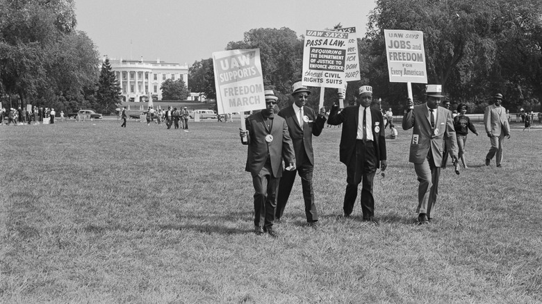 Marchers holding signs