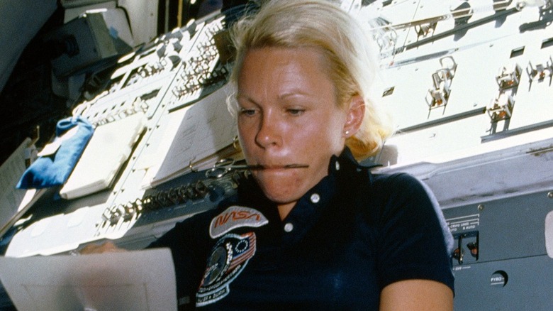 Rhea Seddon working aboard the space shuttle