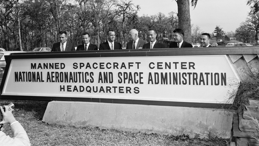 Mercury Seven in front of Manned Spacecraft Center sign