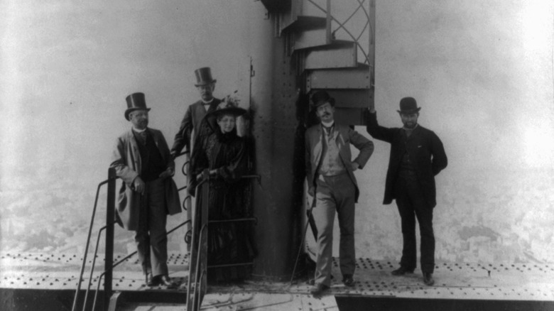 French engineer Gustave Eiffel and four other people at the summit of the Eiffel Tower during Paris world fair, 188