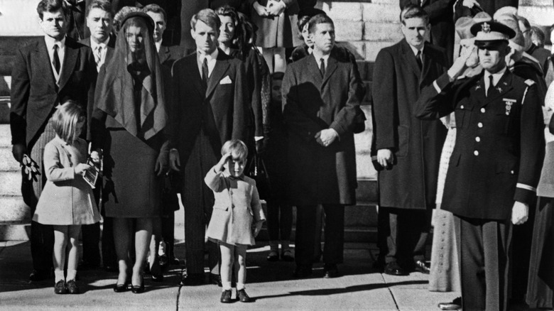 John F Kennedy Jr. saluting his father's casket