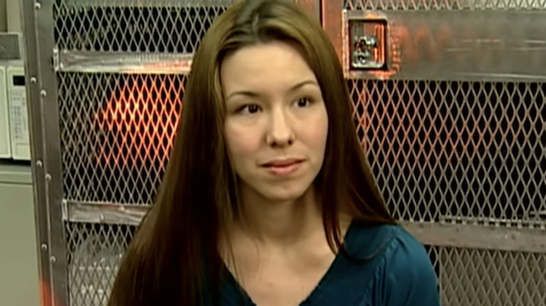 Jodi Arias listening in interview jail door background