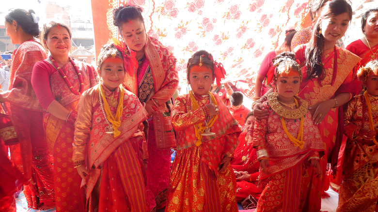  girl and nepal people join with ceremony ritual selection process Kumari Devi or Living Durga goddess at Kathmandu