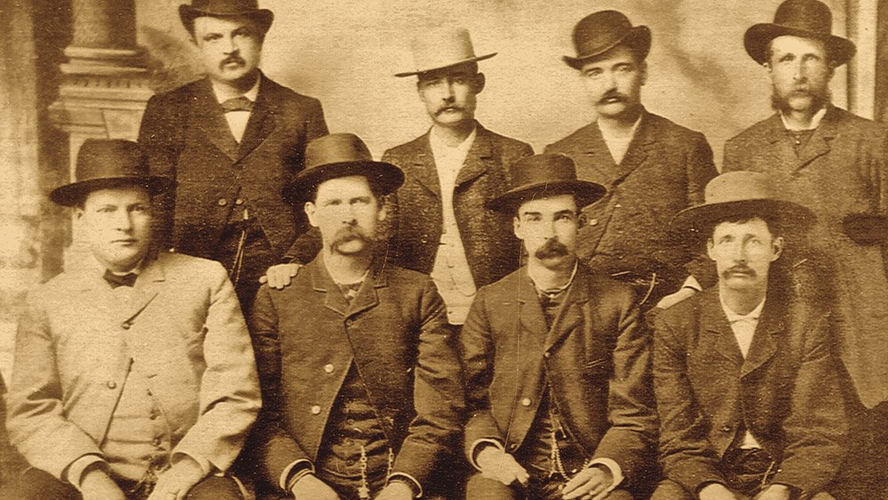 Dodge City Peace Commission, early June, 1883. From left to right, standing: W.H. Harris, Luke Short, Bat Masterson, W.F. Petillon. Seated: Charlie Bassett, Wyatt Earp, Frank McLain (possibly "M. C. Clark"), and Neal Brown