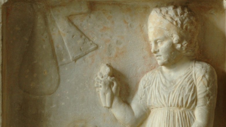Ancient Greek girl with doll