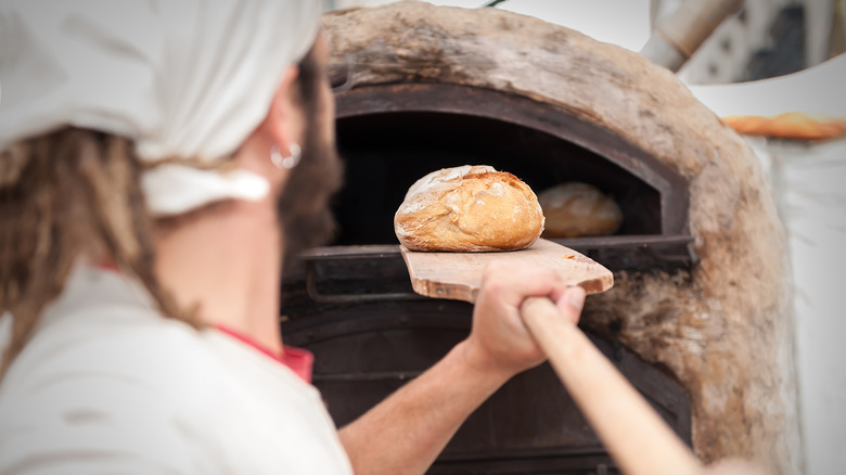 baking bread in an outdoor oven