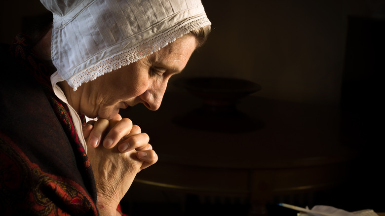 old medieval woman praying