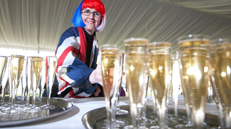 Woman and champagne at a Buckingham Palace event
