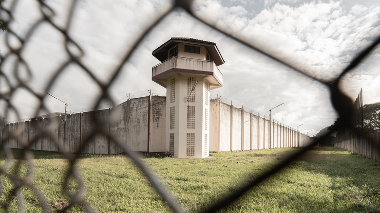 View of prison through fence